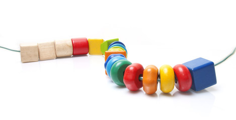 Colorful wooden beads toy on white background
