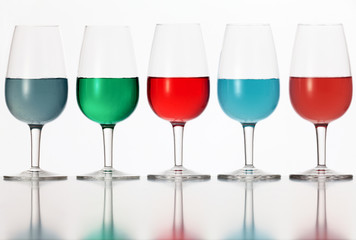 glasses of colored liquid