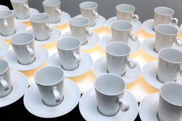 Many white coffee mugs