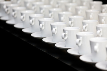 Many white coffee mugs