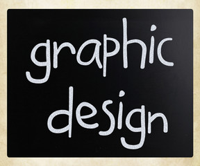 "Graphic design" handwritten with white chalk on a blackboard