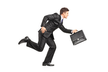 Businessman running with a briefcase - obrazy, fototapety, plakaty