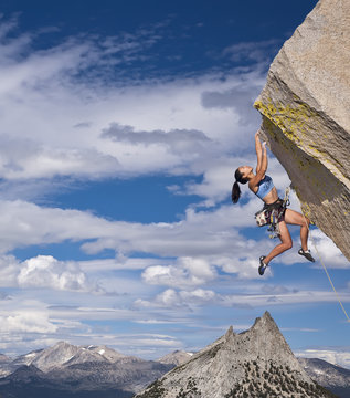Rock climber dangling.
