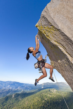 Rock climber dangling.
