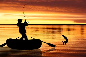 Selbstklebende Fototapeten Fishermen in boat at sunset © Lusia
