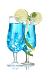 Blue cocktail in glasses with ice and sugar isolated on white