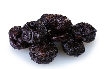 yummy dried plums isolated on white