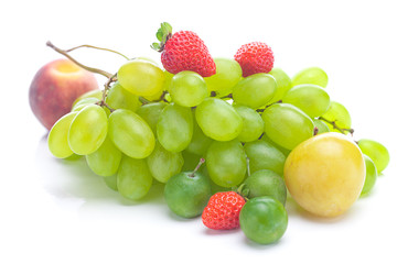 bunch of white grapes, peach and yellow plum isolated on white