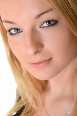 Fototapeta premium Beautiful blond woman on a white