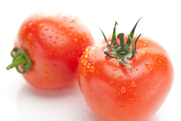 tomato with water drops isolated on white