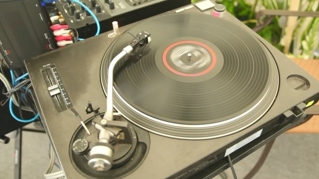 player of vinyl records twists plate and music sounds
