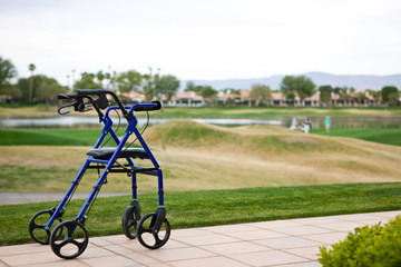 Walker Outdoors on Patio With Golf Course In Background