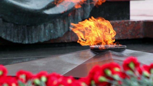 Eternal fire on memorial grave of Unknown soldier