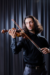 Young violin player playing