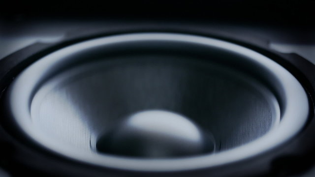 Closeup at moving sub-woofer. Speaker part.