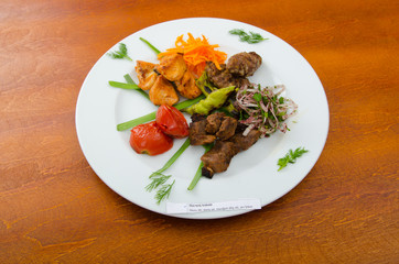 Plate with tasty lamp kebabs