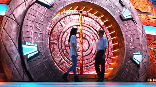 boy with girl meet in front of tunnel, they kiss and leave