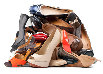 Pile of female shoes over white, with clipping path