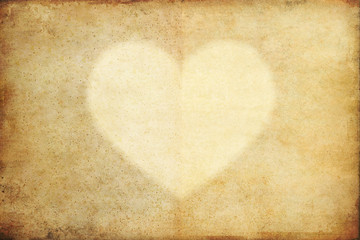 texture of old grunge paper with heart and copy space