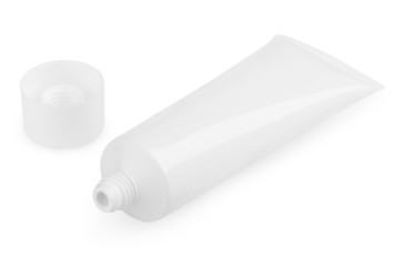 Open white cosmetic tube with cream isolated on white