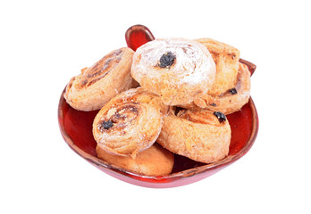 Homemade cookie roll with raisins, isolated on white background