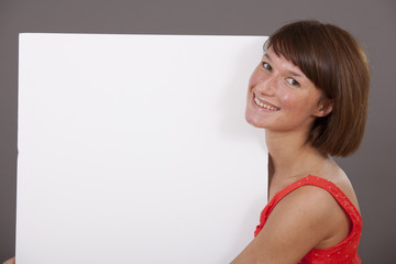 smiling woman with white banner