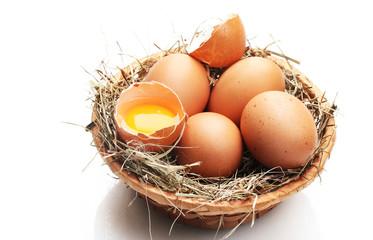 chicken eggs in a nest isolated on white