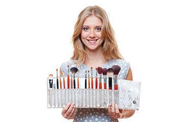 beautiful woman with brushes for make-up