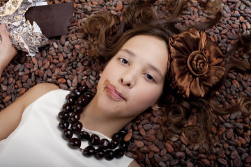 girl with chocolate on cocoa background