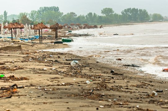 A dirty polluted beach  in the rain