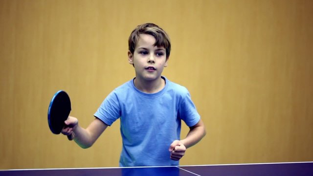 Little Boy Wearing Blue Shirt Playing Ping Pong