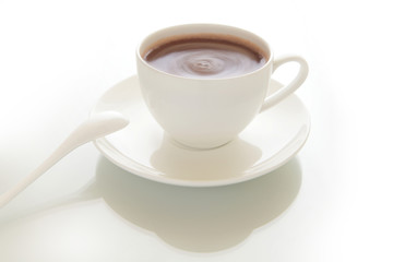 cup of hot chocolate drink with gray background