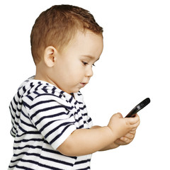 portrait of funny kid touching mobile over white background