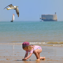 child playing at Island of Oleron - France - 38623639