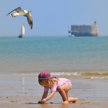 child playing at Island of Oleron - France