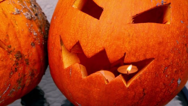 Scary Jack O-Lantern halloween pumpkin with candle inside