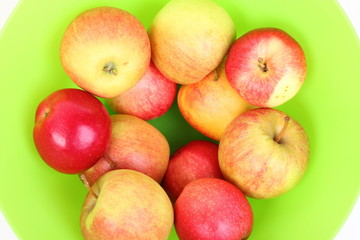 Fresh green, red apples in basket
