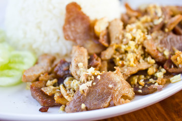 fried pork with garlic and pepper on rice