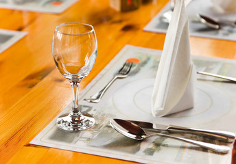 Glasse and plate on table in restaurant
