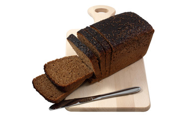 Rye bread and knife on a wooden board