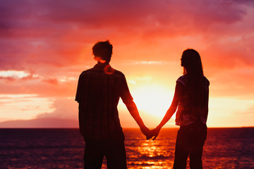 Silhouette of Young Romantic Couple at Sunset