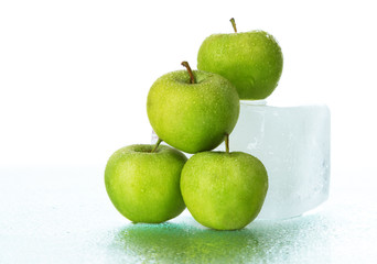 Green apples on ice cube