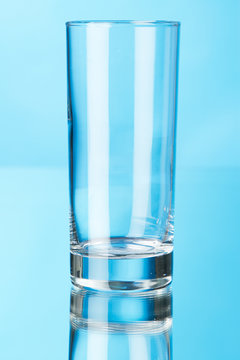 Empty glass isolated on blue background