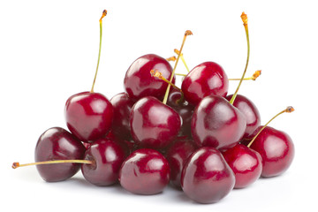 Red ripe cherries over white background