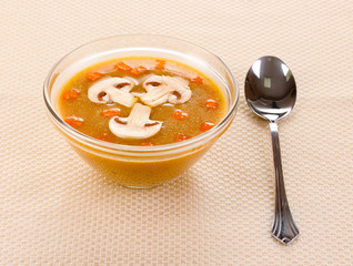 Tasty soup on beige tablecloth