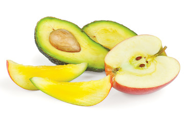 Sliced fresh avocado, apple and mango on a white background