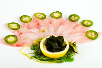 Fresh, raw fish fanned in the shape of peacock feathers