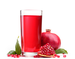 ripe pomergranate and glass of juice isolated on white.
