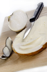 black winter radish on a slice of bread