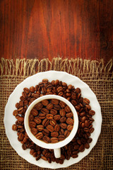 Cup of coffee with coffee beans